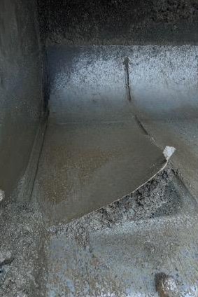 Inside floor of a bucket showing replaced liner plate