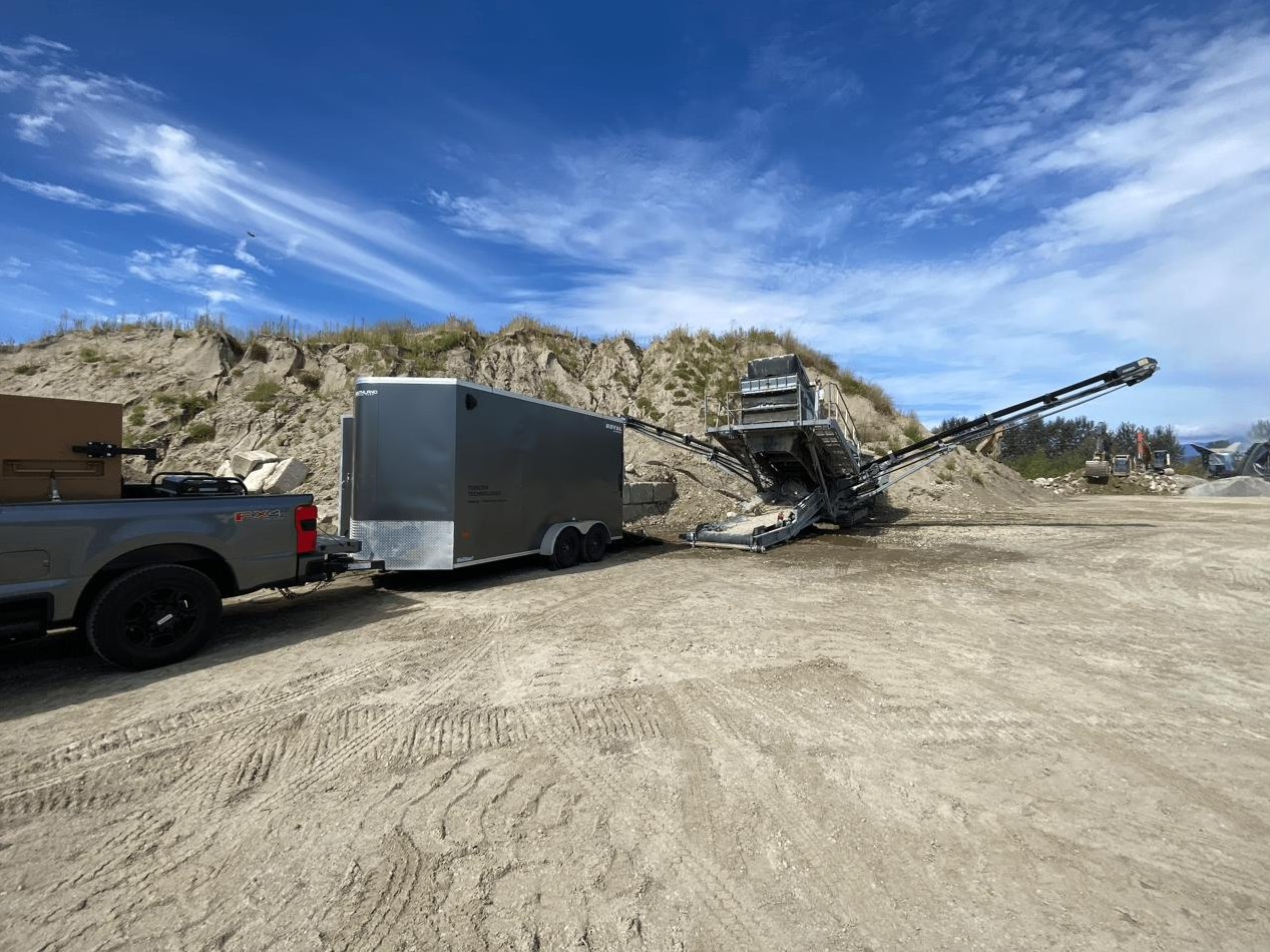 Torsten Technologies truck and enclosed mobile welding trailer set up beside a crushing plant