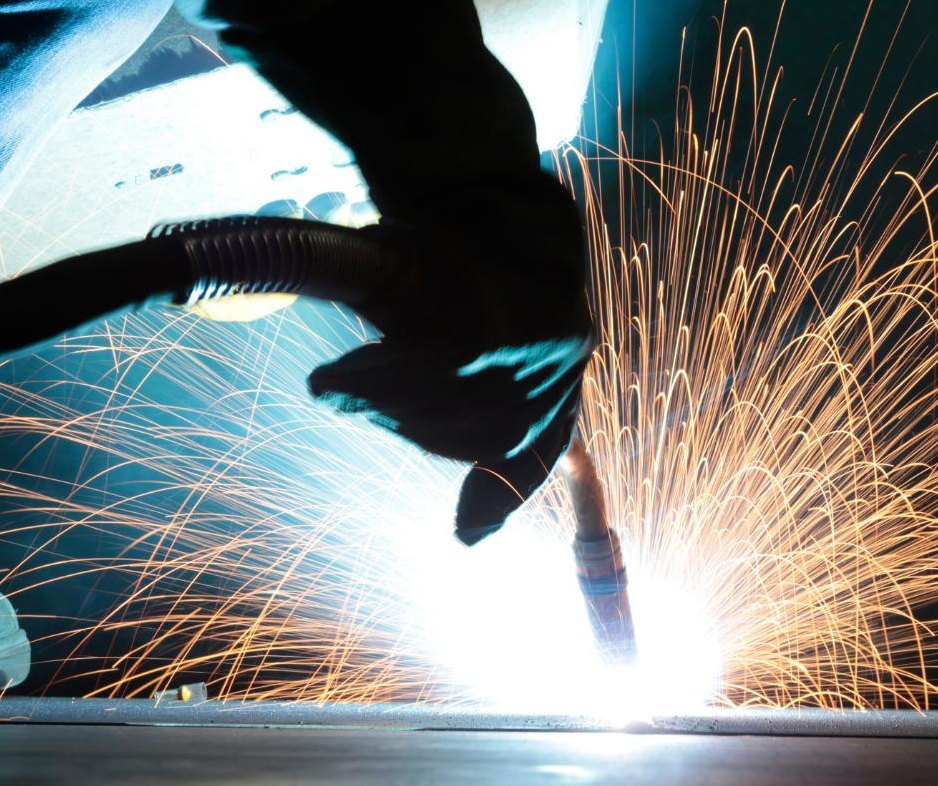 Welder running a bead on a large pipe flange