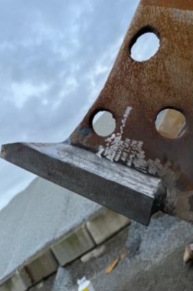 Close-up of hardfacing build-up on a worn ripper shank